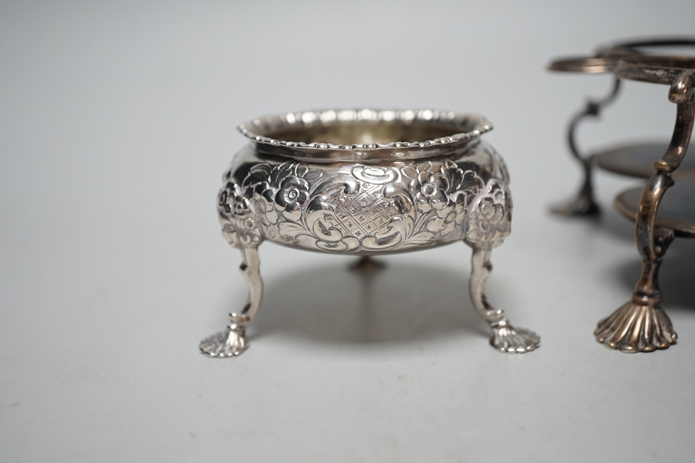 An early George III silver cruet stand, (lacking bottles and piece missing), John Delmester, London, 1763, height 23cm and a Victorian silver salt, 18.4oz.